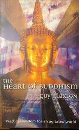 The front cover of the book 'The Heart of Buddhism' by Guy Claxton, featuring a golden Buddha head against a colorful background, photographed on a wooden surface.